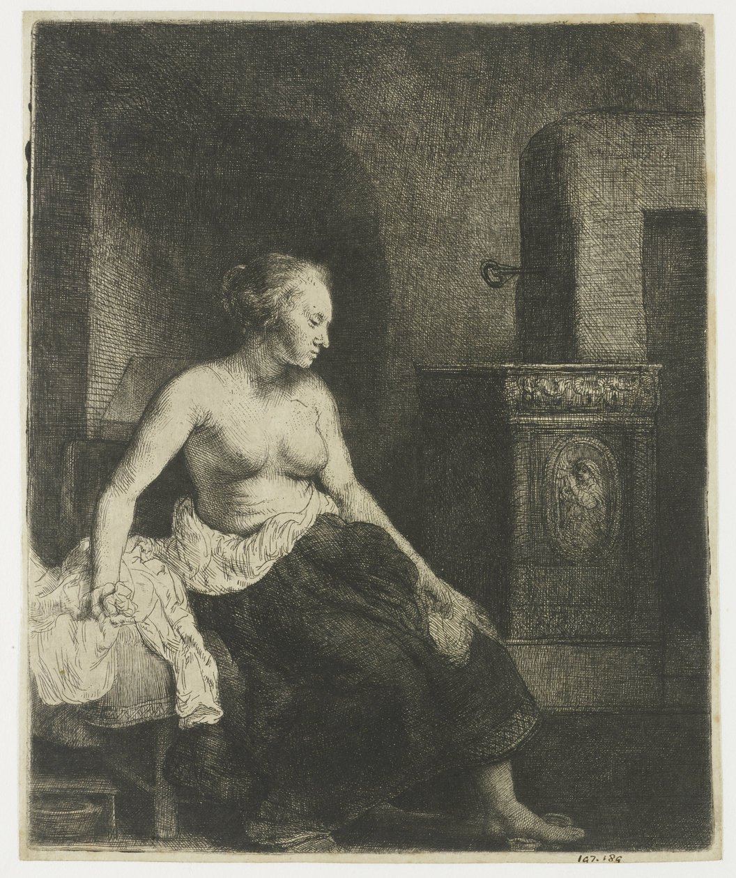 Kobieta siedzi na wpół ubrana obok pieca autorstwa Rembrandt van Rijn