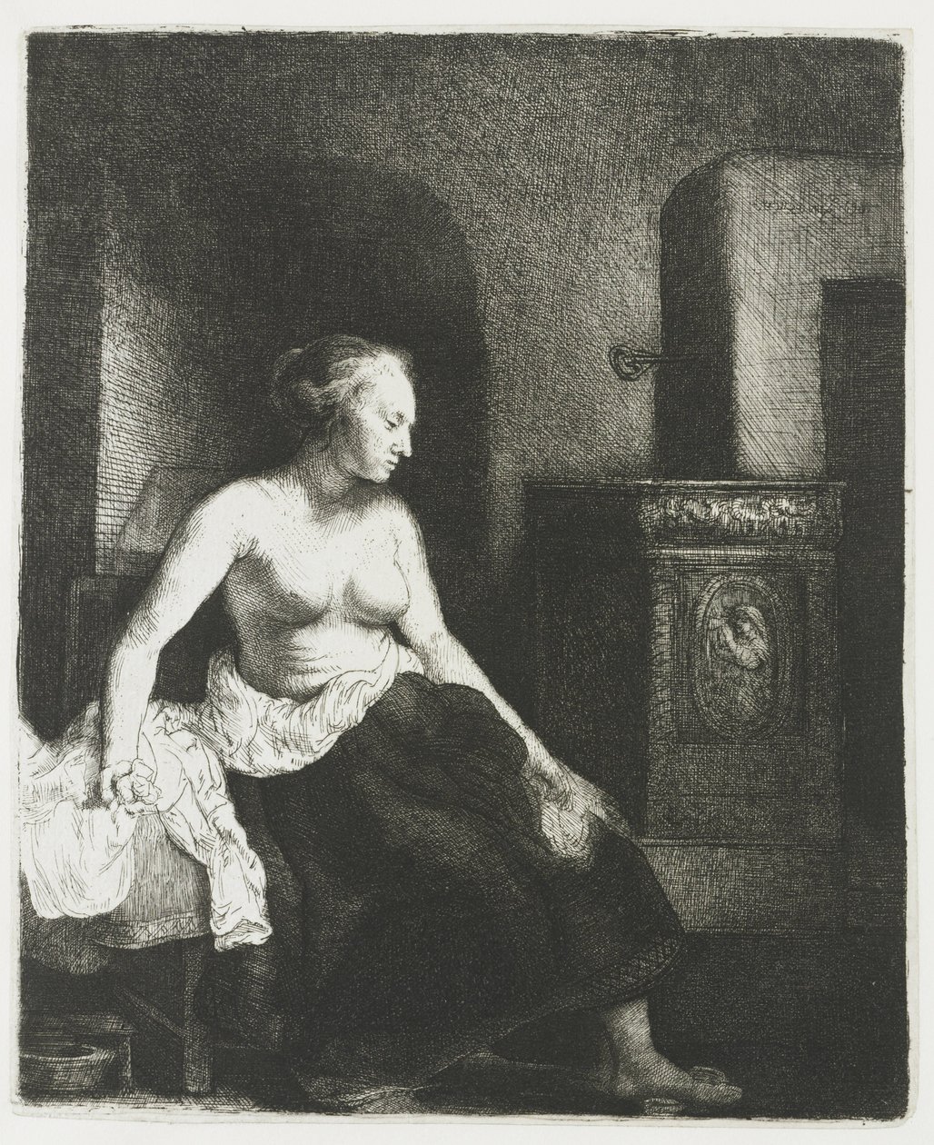Kobieta siedzi na wpół ubrana obok pieca autorstwa Rembrandt van Rijn