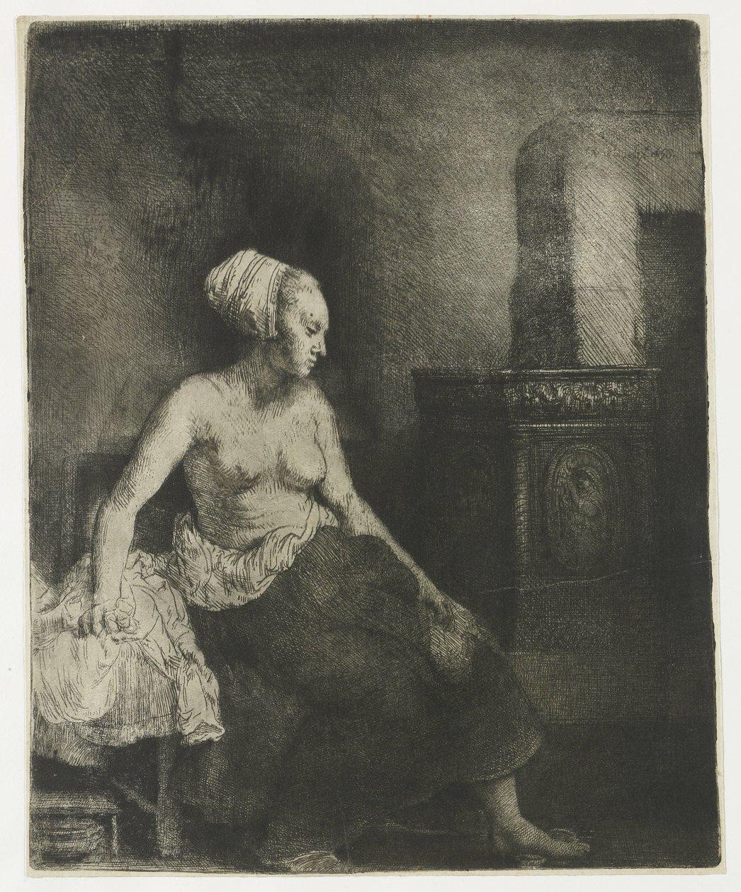 Kobieta siedzi na wpół ubrana obok pieca autorstwa Rembrandt van Rijn
