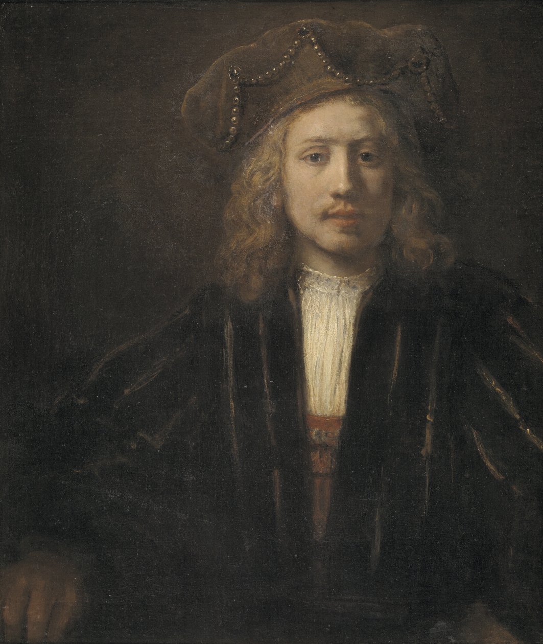 Młody mężczyzna w czapce z perłami autorstwa Rembrandt van Rijn