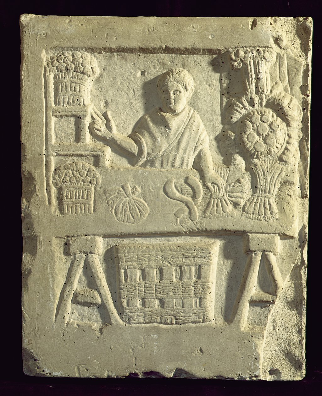 Relief przedstawiający sprzedawcę kwiatów i warzyw autorstwa Roman
