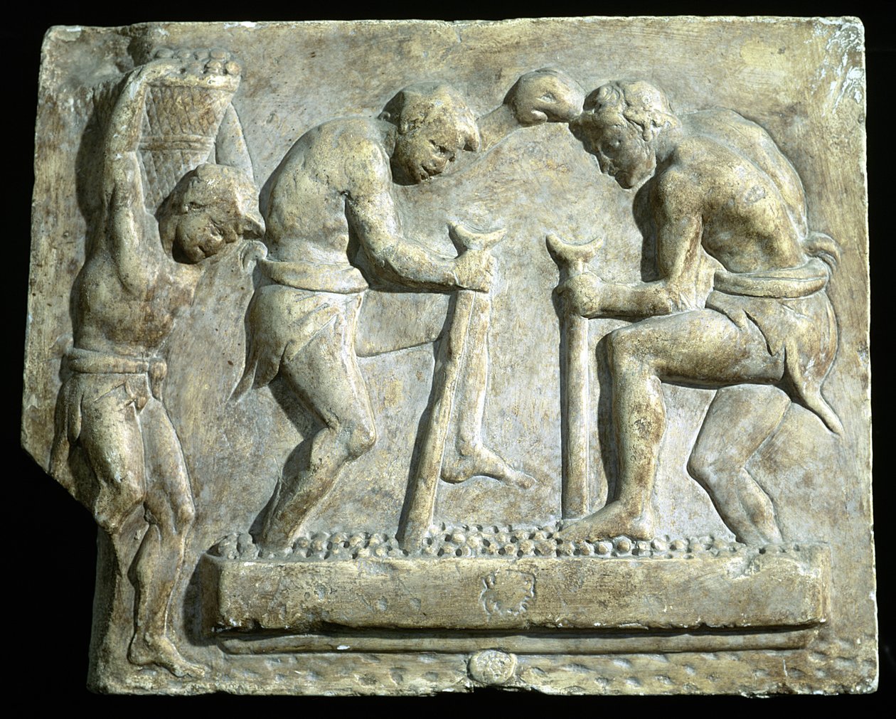 Relief przedstawiający brukarze autorstwa Roman