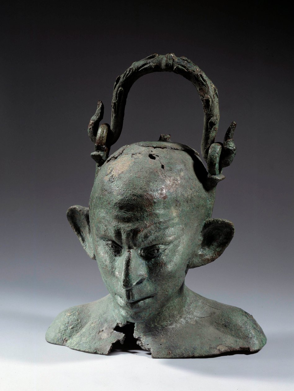 Brązowy wazon w kształcie głowy: popiersie syryjskiego niewolnika (?). II lub III wiek po JC. Słońce 0,19 m Paryż, Musee du Louvre autorstwa School Syrian