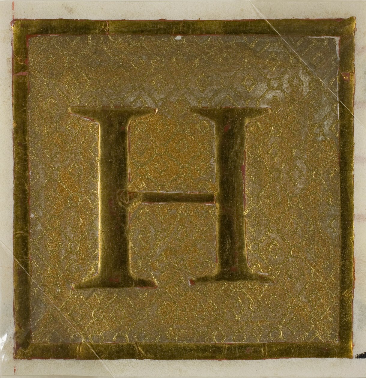Podświetlany inicjał "H" we wzorze pieluchy z podręcznika chóru autorstwa Unknown artist