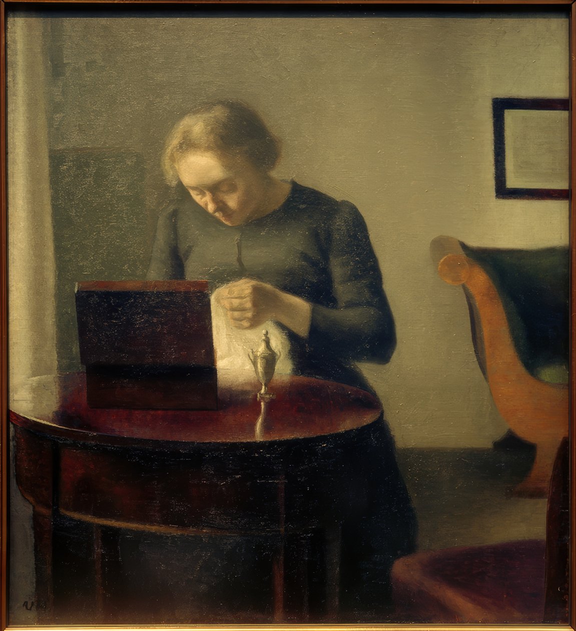 Żona artysty przy stole do szycia autorstwa Vilhelm Hammershoi