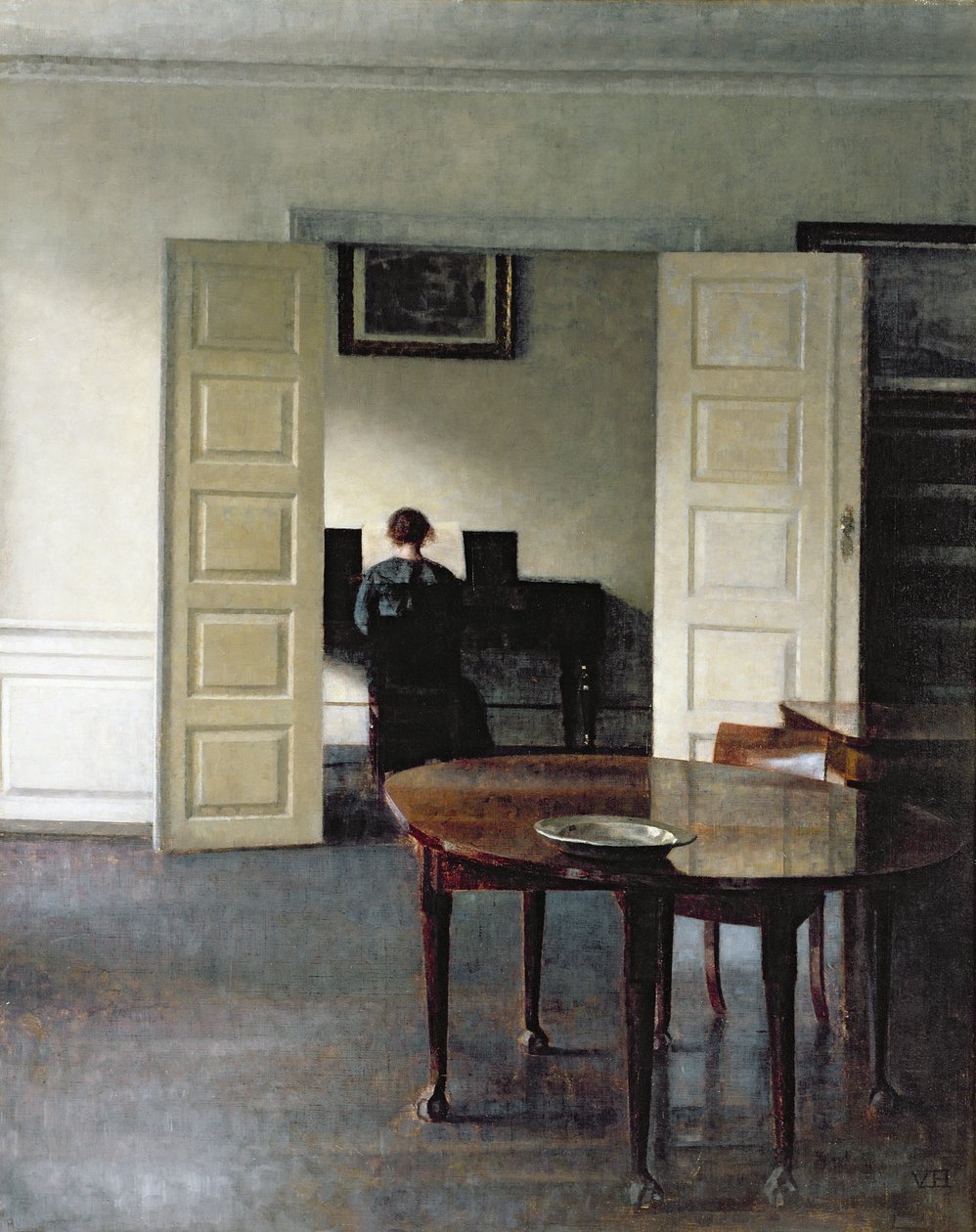 Wnętrze z kobietą grającą na pianinie, 1910 autorstwa Vilhelm Hammershoi
