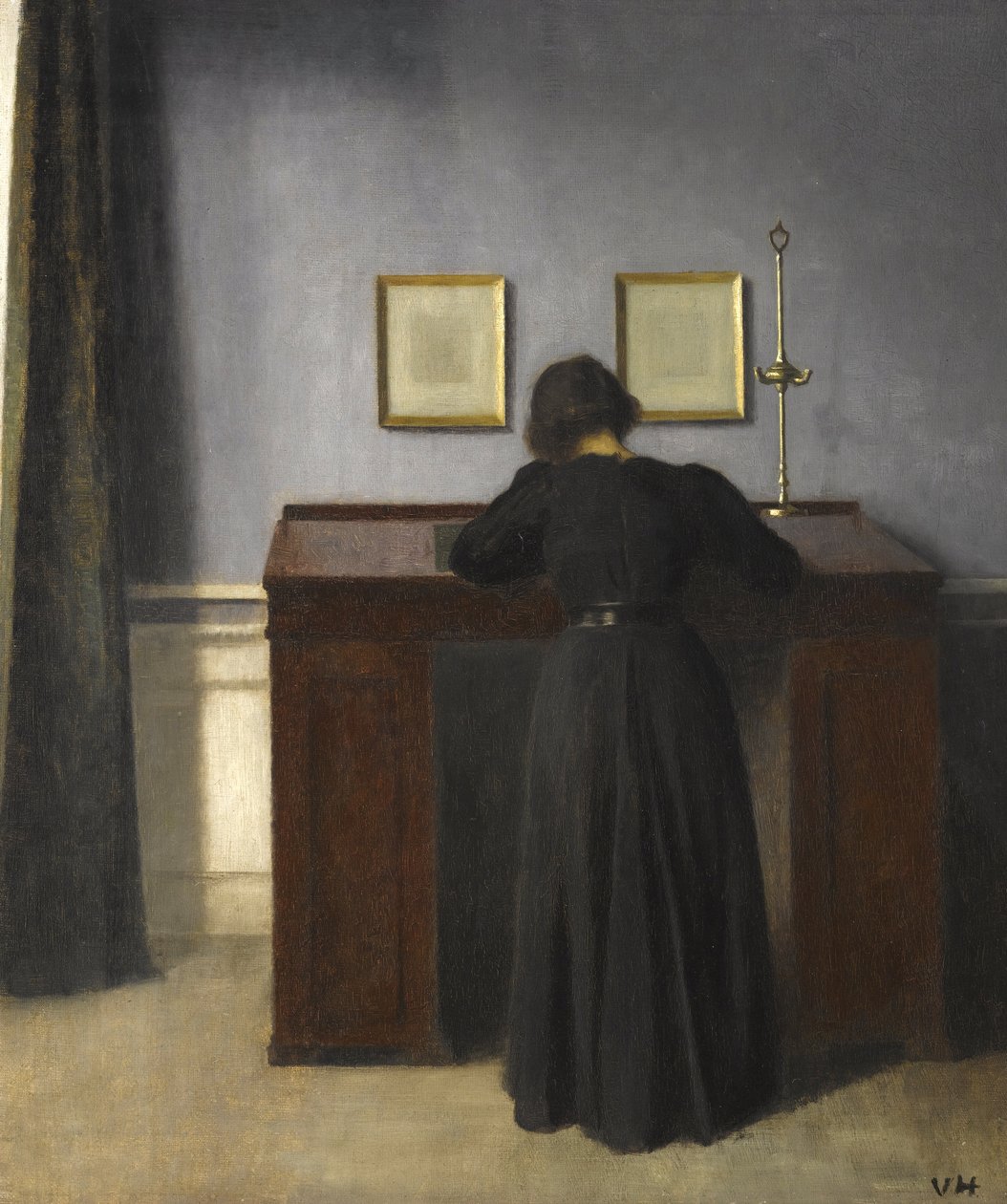 Ida stojąca przy biurku, 1900 autorstwa Vilhelm Hammershoi