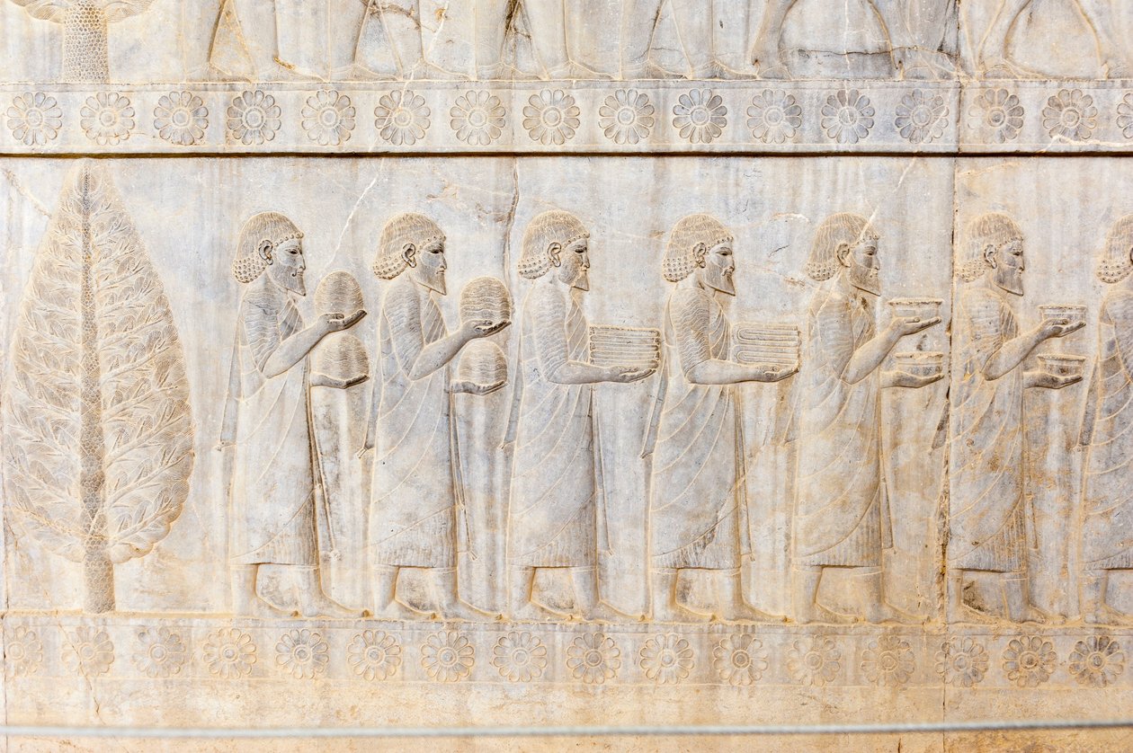 Starożytna płaskorzeźba Achemenidów; delegacja Jonów; Pałac Apadany; Strona archeologiczna; starożytne perskie miasto Persepolis; Światowego Dziedzictwa UNESCO; Prowincja Fars; Iran; Azja autorstwa Frederick (attr. to) Barnard