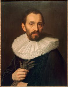 Portret mężczyzny trzymającego rękawiczki, lekko w lewo