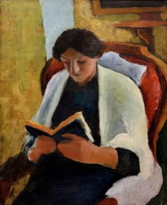 Czytająca kobieta w czerwonym fotelu autorstwa August Macke