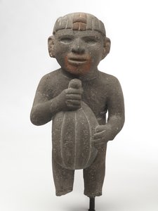 Mężczyzna niosący strąk kakao, 1440-1521 (kamień wulkaniczny ze śladami czerwonego pigmentu) autorstwa Aztec