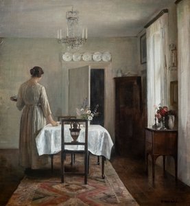 Żona artysty nakrywająca stół
