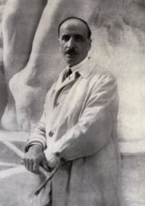 Portret w trzech czwartych przedstawiający rzeźbiarza Edoardo Rubino z marteliną w dłoni. W tle można dostrzec rzeźbę autorstwa Carlo Gherlone