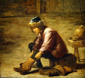 Młody mężczyzna ciągnący but autorstwa David Teniers the Younger
