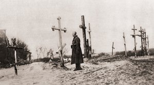 Rosyjski żołnierz na grobie towarzysza broni w czasie I wojny światowej, z Ilustrowanych Wiadomości Wojennych, 1915 autorstwa English Photographer