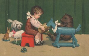 Młody chłopak siedzi bawiąc się swoimi zabawkami w przedszkolu autorstwa English School
