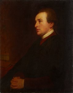 Portret młodego mężczyzny przy biurku