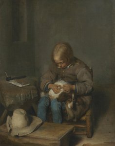 Chłopiec wyławiający pchły z psa