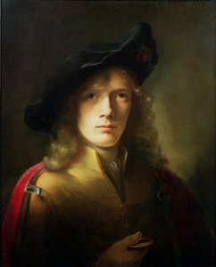 Portret młodego mężczyzny trzymającego medal