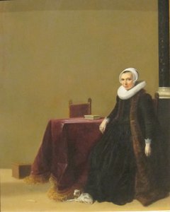 Portret kobiety z psem autorstwa Hendrik Gerritsz Pot