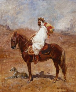 Arab na koniu w pustynnym krajobrazie