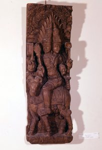Agni, bóg ognia, przedstawiony z dwiema głowami (bicefalem) na baranie, według mitologii hinduskiej. Rzeźba w drewnie z XVII wieku. Paryż, Musée Guimet. autorstwa Indian School
