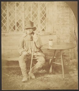 [Mężczyzna siedzi przy stole] autorstwa John Whistler
