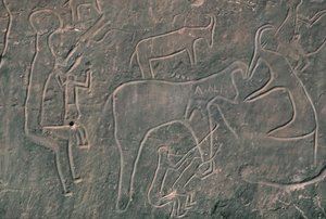 Postacie ludzkie i zwierzęta (malarstwo naskalne) autorstwa Prehistoric