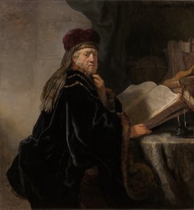 Uczony siedzący przy biurku Uczony w swoim gabinecie autorstwa Rembrandt van Rijn
