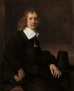 Młody mężczyzna siedzący przy stole, prawdopodobnie Govaert Flinck, ok. 1930 r. 1660. autorstwa Rembrandt van Rijn