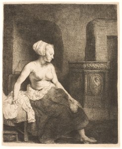 Kobieta siedzi na wpół ubrana obok pieca autorstwa Rembrandt van Rijn