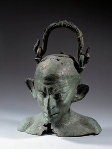 Brązowy wazon w kształcie głowy: popiersie syryjskiego niewolnika (?). II lub III wiek po JC. Słońce 0,19 m Paryż, Musee du Louvre