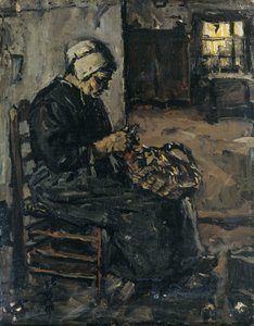 Chłopka obierająca ziemniaki