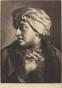 Mężczyzna w turbanie i koszuli w paski