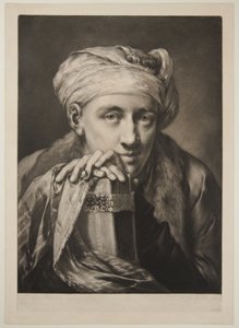 Mann mit Turban, der sich auf ein Buch stützt