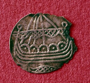 Coin depicting a drakkar (metal)