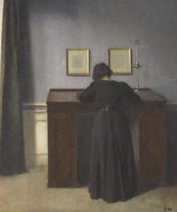 Ida stojąca przy biurku autorstwa Vilhelm Hammershøi