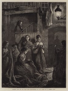 Londyńskie życie na East Endzie, Wyrabianie worków przy świetle lampy ulicznej (rycina) autorstwa William Bazett Murray