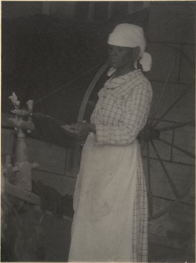 Kobieta przy kołowrotku autorstwa Doris Ulmann