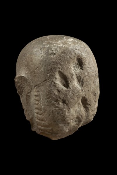 Głowa posągu boga Min (wapień) autorstwa Egyptian