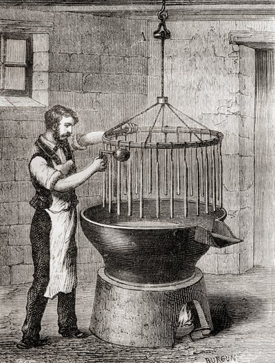 Handlarz wyrabiający świece w XIX wieku, z "Les Merveilles de la Science", opublikowanego ok. 1870 r. (rycina) autorstwa French School