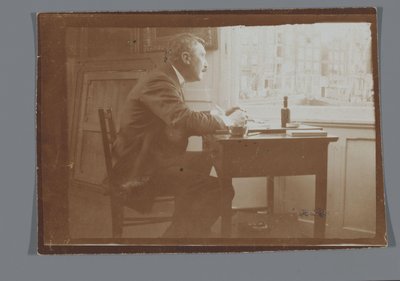 Willem Witsen przy biurku w swojej łodzi autorstwa George Hendrik Breitner