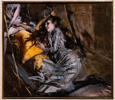 Leżąca dziewczyna w sukience w szkocką kratę autorstwa Giovanni Boldini
