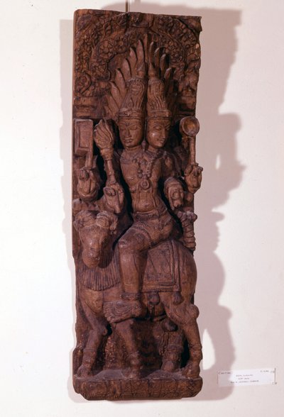 Agni, bóg ognia, przedstawiony z dwiema głowami (bicefalem) na baranie, według mitologii hinduskiej. Rzeźba w drewnie z XVII wieku. Paryż, Musée Guimet. autorstwa Indian School