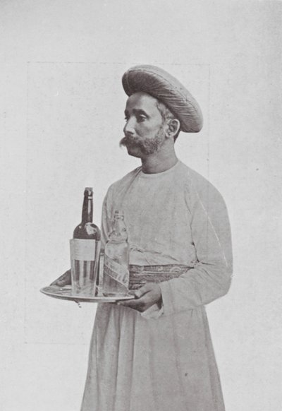 Bombaj: Chłopiec przy stole (zdjęcie czarno-białe) autorstwa Indian photographer