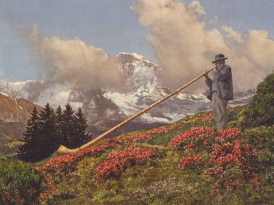 Szwajcaria: Dmuchawa z rogów alpejskich, w tle Jungfrau (kolorowe zdjęcie) autorstwa Jean Gaberell
