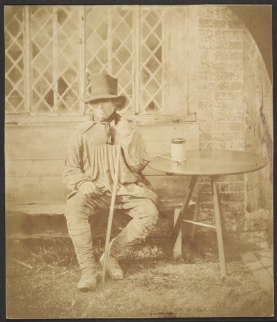 [Mężczyzna siedzi przy stole] autorstwa John Whistler