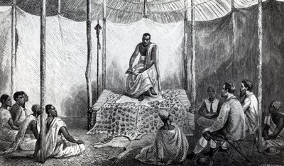 Pierwsza lekcja Kamrasiego w Biblii, ilustracja z „Dziennika odkrycia źródła Nilu” autorstwa Johna Hanninga Speke, opublikowanej w 1864 roku autorstwa Josiah Wood Whymper