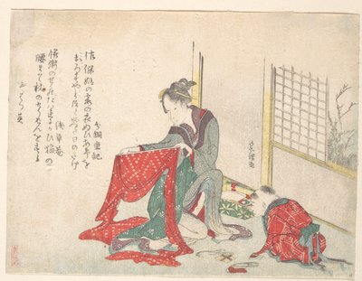 Kobieta składająca tkaninę autorstwa Katsushika Hokusai