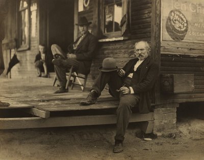 Dwóch mężczyzn i chłopiec na werandzie autorstwa Lewis W. Hine